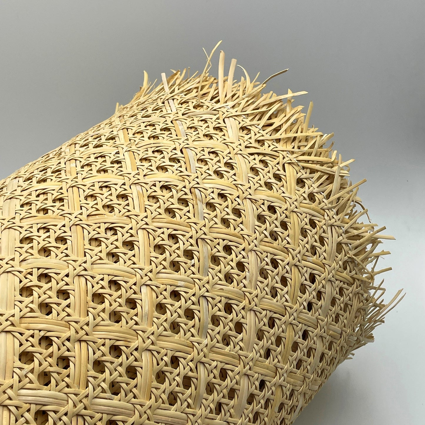 Linear meter of woven rattan mesh fabric width 60.96 cm.