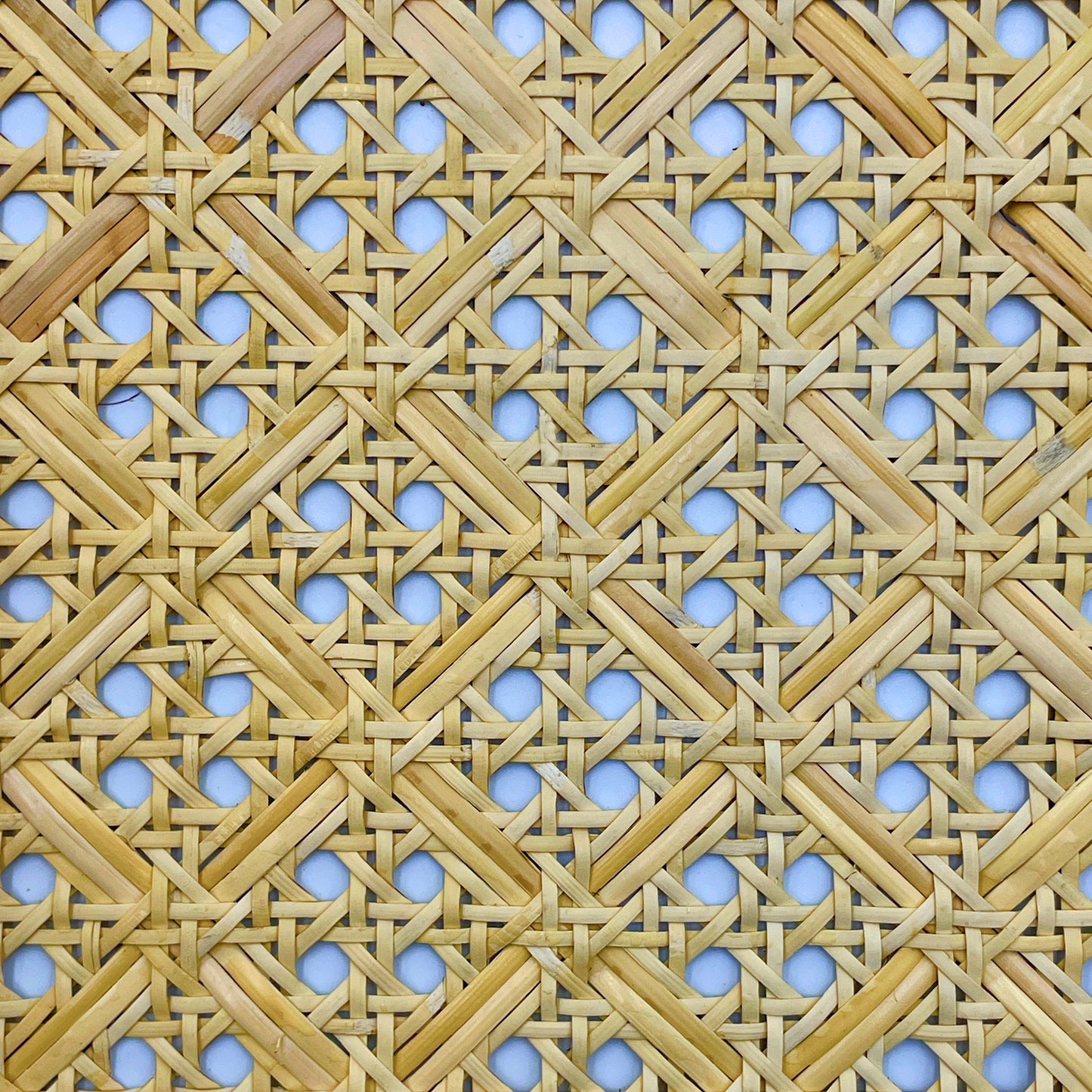 Linear meter of woven rattan mesh fabric width 60.96 cm.